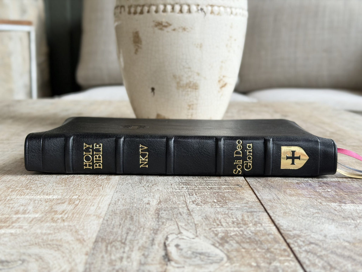 Black Loch Ness NKJV Large Print Thinline Reference (Premier Collection) by Rock Wall Bibles, spine at an angle