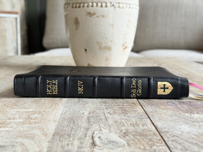 Black Loch Ness NKJV Large Print Thinline Reference (Premier Collection) by Rock Wall Bibles, spine at an angle