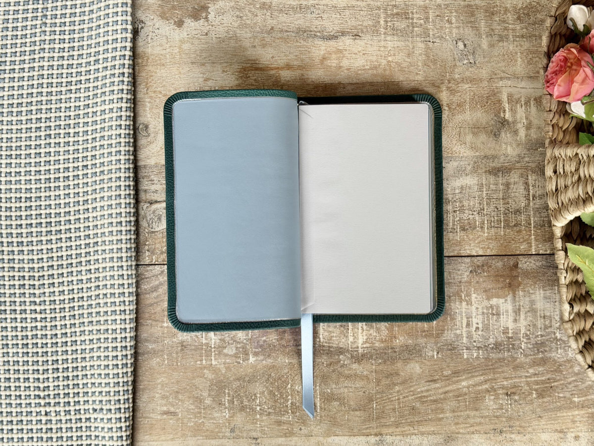 Turquoise Minerva Box NIV Thinline Reference (Premier Collection) by Rock Wall Bibles, inside cover liner
